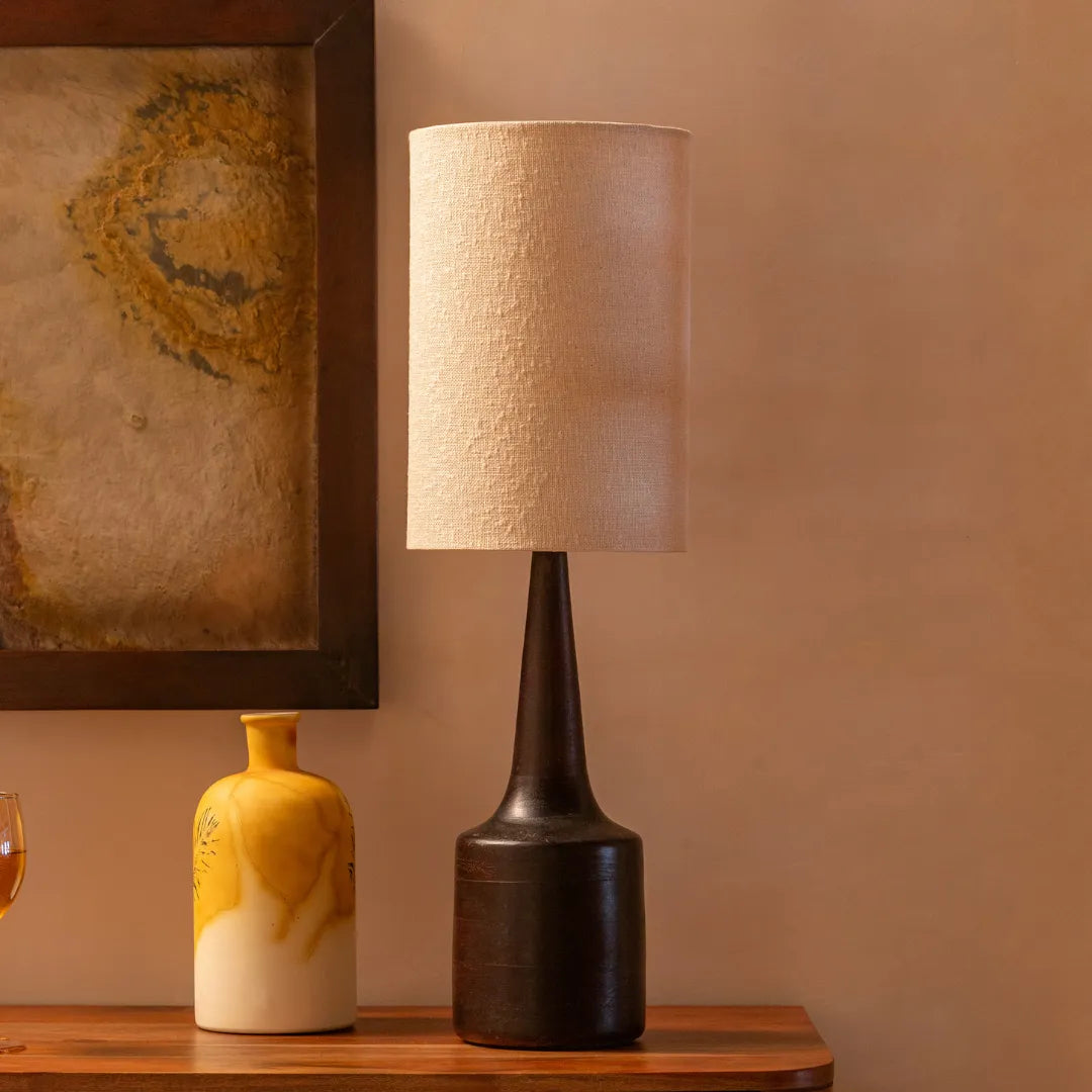Petal Table Lamp with a textured shade and a wooden vase on a wooden surface