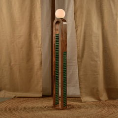 Designer Parabola Floor lamp with a teak wood base adorned with handmade green tiles, leading up to a white spherical light fixture.