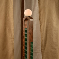 Parabola Floor Lamp close-up detail of its arched silhouette and handmade wooden & green tile base
