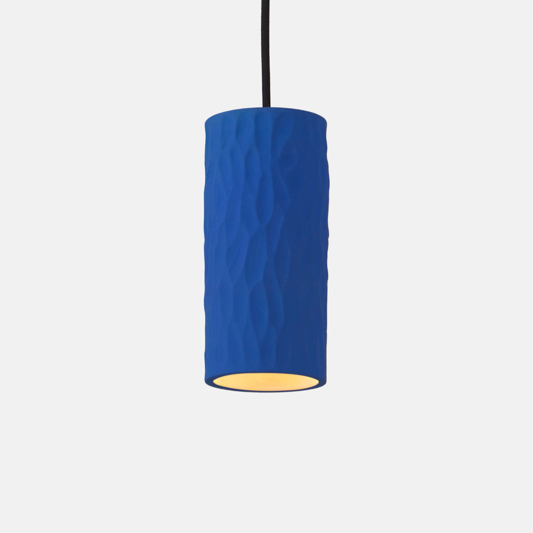 Blue textured pendant light on a white background
