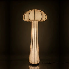 Mushroom-shaped floor lamp with a textured shade on a dark background