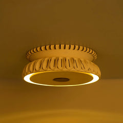 Totem Flush Mount lit, warm halo glowing from ceramic rim