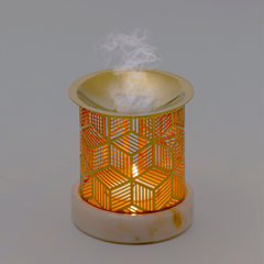 Decorative oil burner Aura Diffuser with geometric design on a gray background