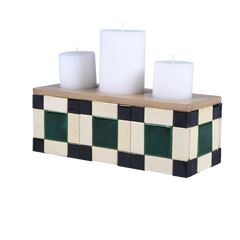 Blade of Grass Candle Holder with checkered design and three white candles on a white background