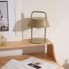 Modern beige Porto Table Lamp on a wooden surface with a minimal background