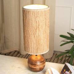 Jute Table lamp with wooden base and textured fabric shade on a surface.