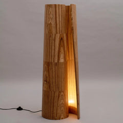 Wooden floor lamp with a unique design on a plain background
