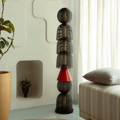 Modern Totem Black Floor Lamp with black and red design in a room
