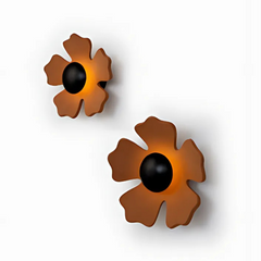 Side view of ceramic petal texture of flower wall light on a white background