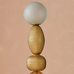 Lagori Black Floor Lamp close-up detail of gold double-cast glass and white spherical top 