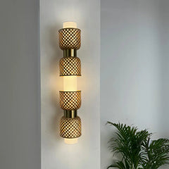 Metamorphosis Linear Wall Lamp emphasizing slim depth and modular elements in sustainable design, showing mesh-like lampshades on a gray wall.