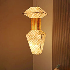 Geometric pendant light with woven design on a neutral background