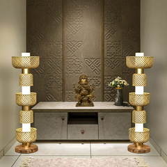 Metamorphosis floor lamp displayed as a pair in a temple-inspired decor setting