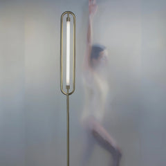 Loop Tall floor lamp with LED strip lighting & gold finish and a steel powder coating.
