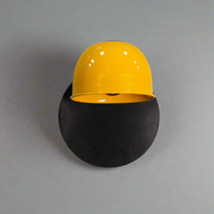 Close-up of Industrial Half-Dome Wall Sconce yellow powder-coated metal dome with black mounting plate
