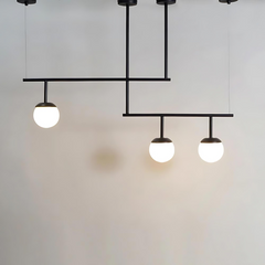 Black metal chandelier with 3 glass spheres for luxury interiors