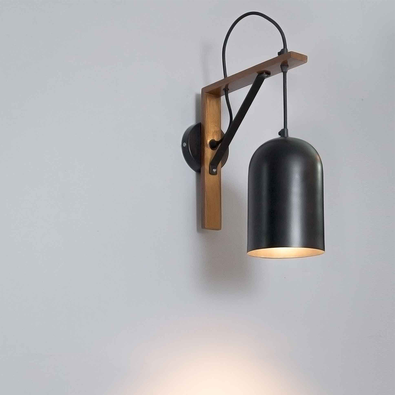 Hanging wall lamp made of teak & iron above wooden console in apartment hallway
