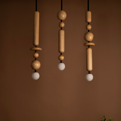 Three Pendant Light with wooden modules and black metal rods, suspended from the ceiling