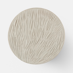 Close up of clay disc wall sconce texture