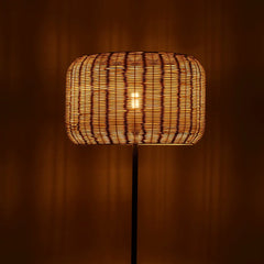 Close-up of the natural rattan weave on the Bird's Nest floor lamp shade
