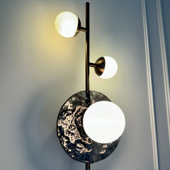 Close-up view of Wall Sconce glass disc with opaline glass globe detailing