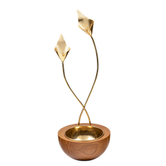 Decorative gold and wooden bowl with lily stems-like extensions on a white background