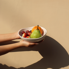 A round Speckled Ceramic bowl with fruits