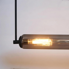 Close look of pendant lamp showing fluted clear glass tube