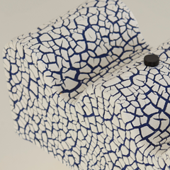 Close view of Wave Table Lamp shade crafted with ceramic in blue and white lines 