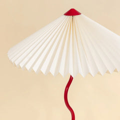 Wavy Floor Lamp close-up detail white hand-pleated paper shade and crimson red tip and handle
