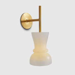 Alabaster wall-mounted light fixture with a gold-colored metal arm and an alabaster white light diffuser.