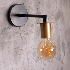 Side look of Modern Industrial Wall Light with a sleek black arm extending from a round base mounted on a wall