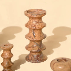Astra Brown Marble Candle holders with a textured surface and glossy natural finish