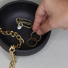 Jewelry placed in Black color Pluto Bowl made of ceramic 