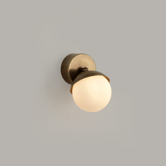 Fly Wall Sconce Small mounted on wall in a modern bedroom setting