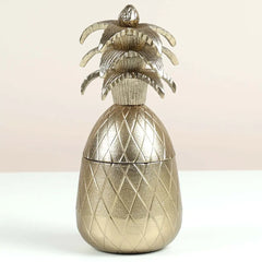 Decorative pineapple-shaped Votive with a textured surface on a light background