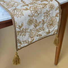 Rosabelle Chintz Ochre Table Runner end drop with tassels over table edge