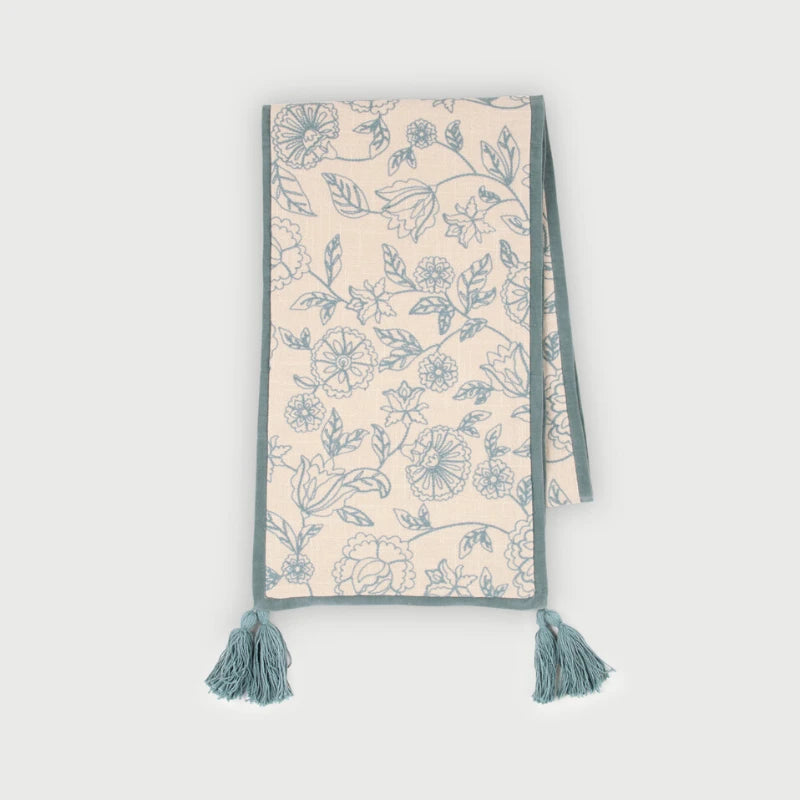 Rosabelle Chintz Teal Table Runner laid flat, floral patterned embroidery with microvelvet borders & tassels  