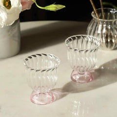 Mini Twirl Bowl - Set of 6 – pair of ribbed clear glass bowls with blush pink bases on a marble table