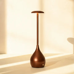 Beam Portable Lamp - bronze-colored table lamp on a light background
