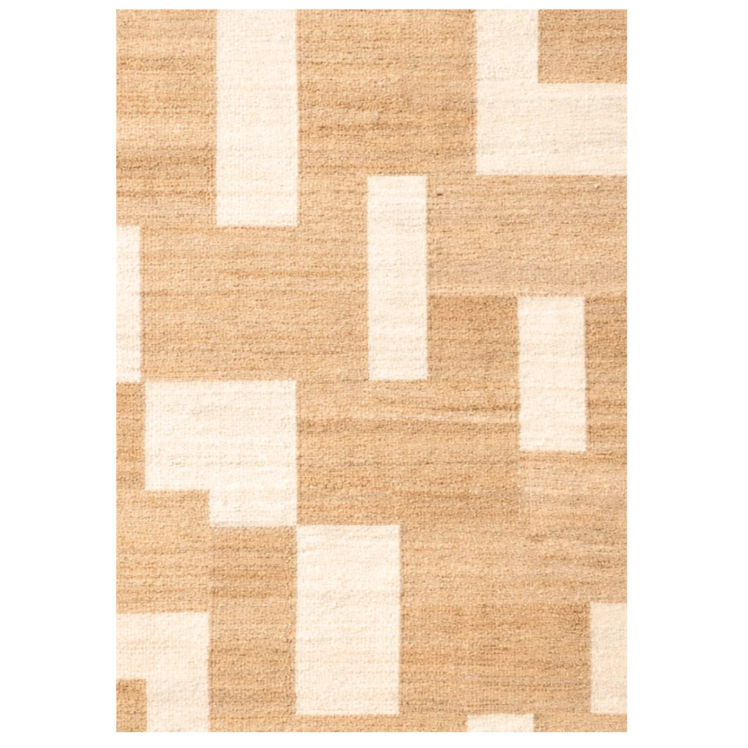 Beige and white geometric patterned rug on a white background