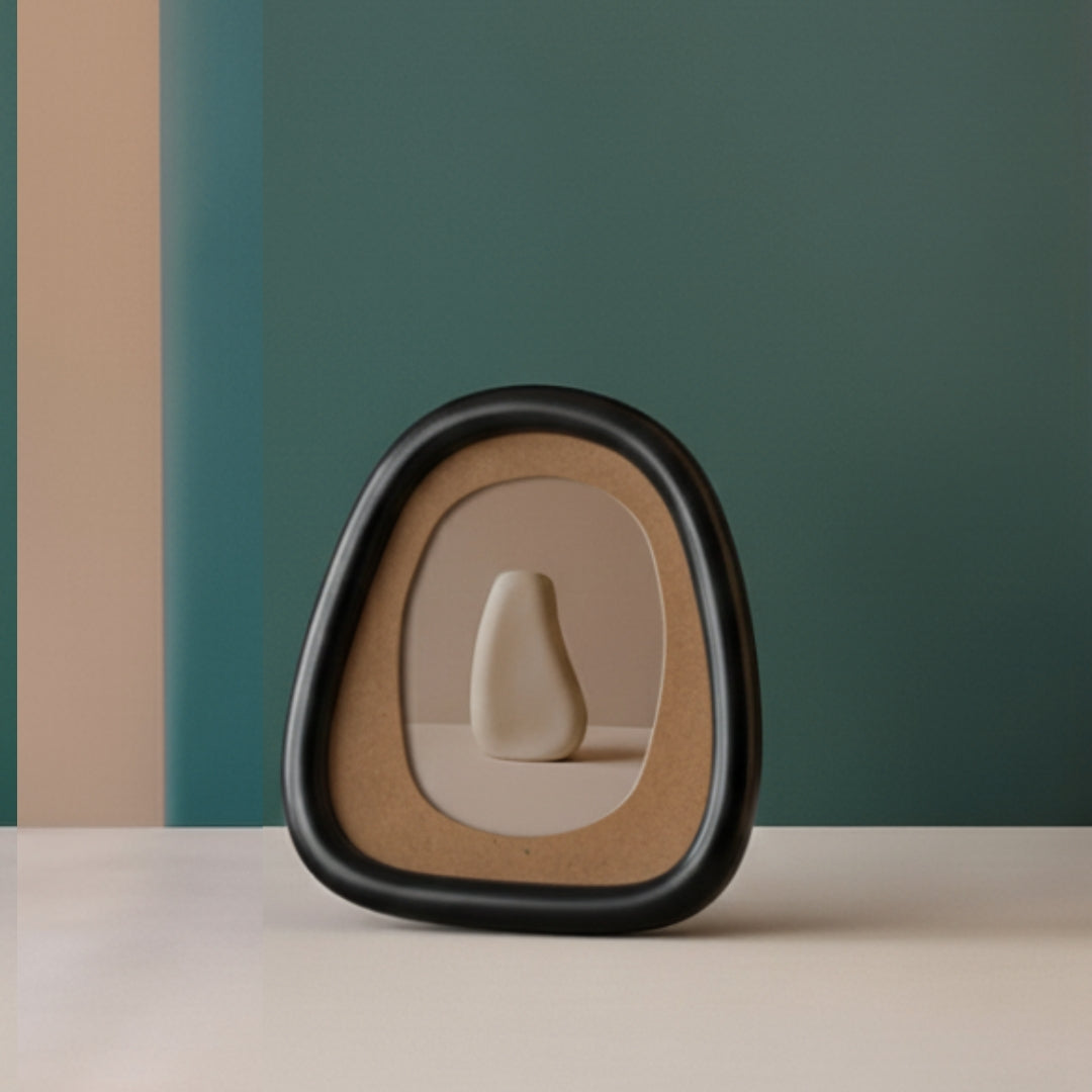 A mushroom-shaped table lamp with a pleated white paper-like shade and base, glowing warm yellow on a wooden cabinet in a styled interior setting.