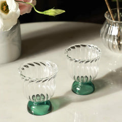 Mini Twirl Bowl - Set of 6 – two fluted glass bowls with deep teal bases, close-up on white marble