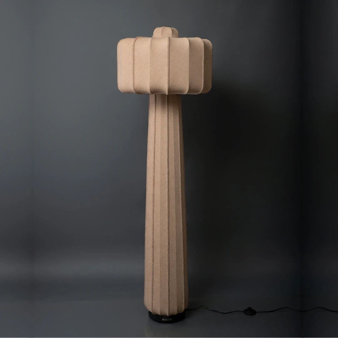 Beige Valo floor lamp with a unique design on a dark background