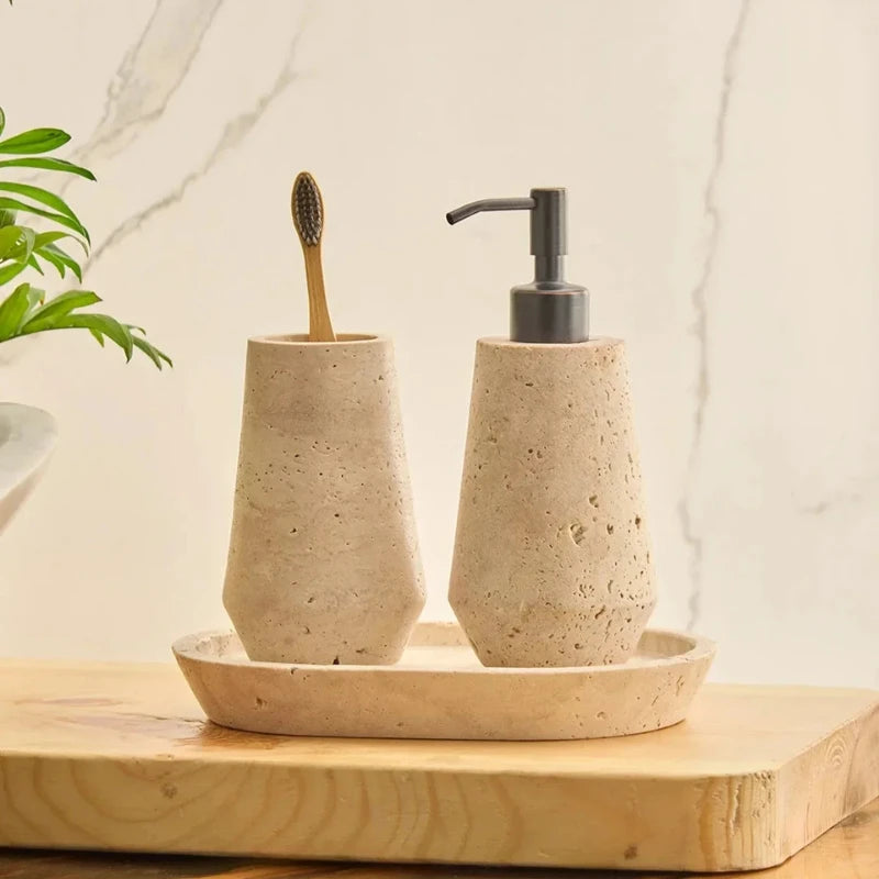 Otel Travertine Dispenser Set - Faceted Travertine Tumbler and Dispenser on Oval Tray Beside Plant