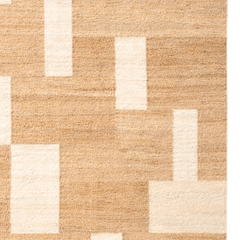 Beige and white geometric patterned rug