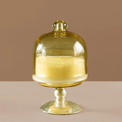 Sundance Aura Candle in Balmy Bergamot scent, close-up of opalescent yellow cloche over pale yellow soy wax