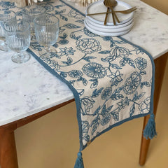 Rosabelle Chintz Teal Table Runner on marble dining table with glassware and plates