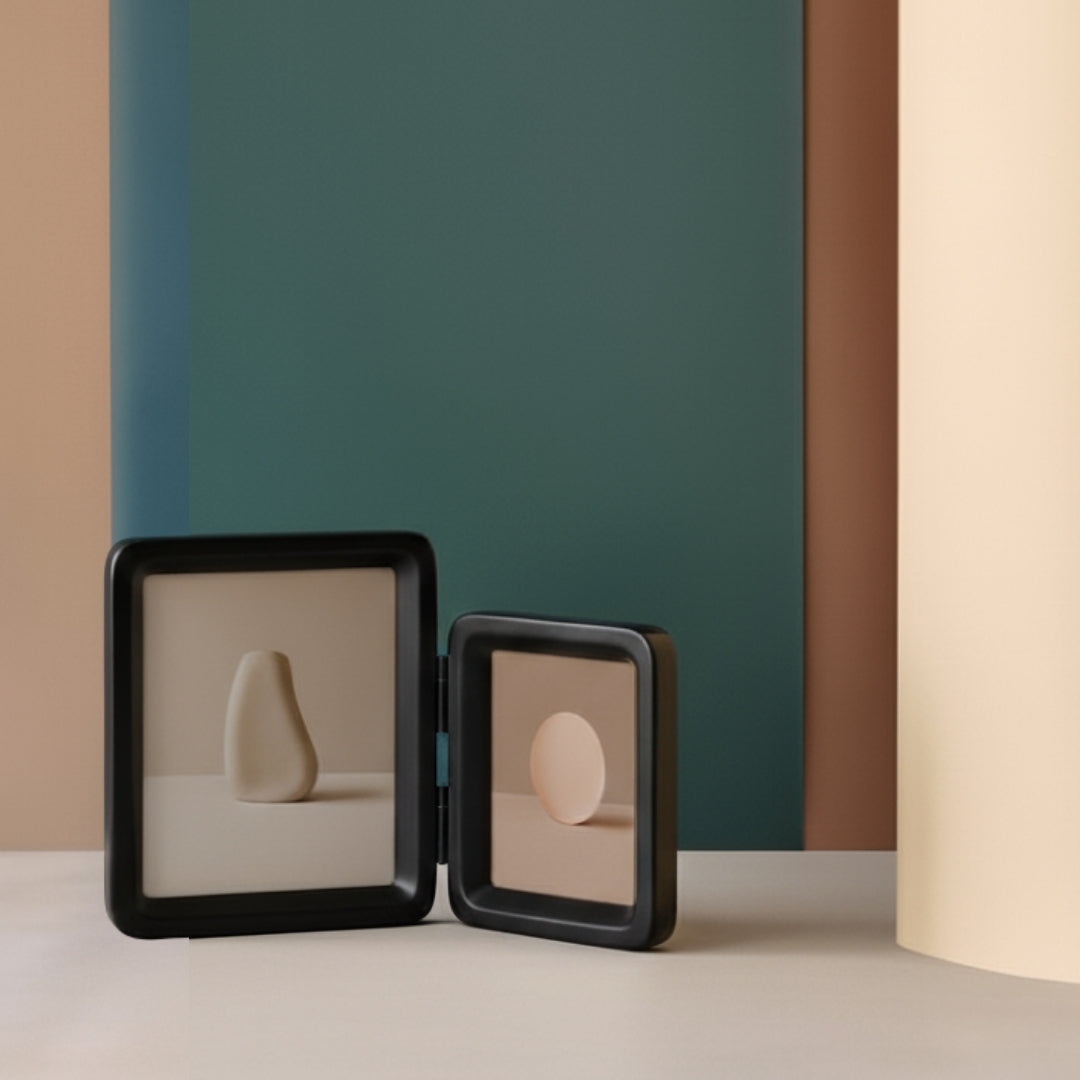 Two black Tandem Photo framed with sculpture picture on a neutral background with a colorful wall.
