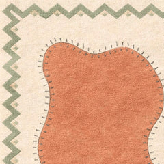 Close-up of a textured fabric with a zigzag border on a beige background